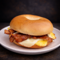 plain bagel sandwich with bacon egg and cheese