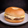 plain bagel sandwich with sausage egg and cheese