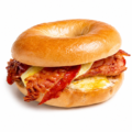 French toast bagel with egg sausage bacon and maple drizzle