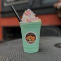 green mint frappe with shipped cream and colorful marshmallows